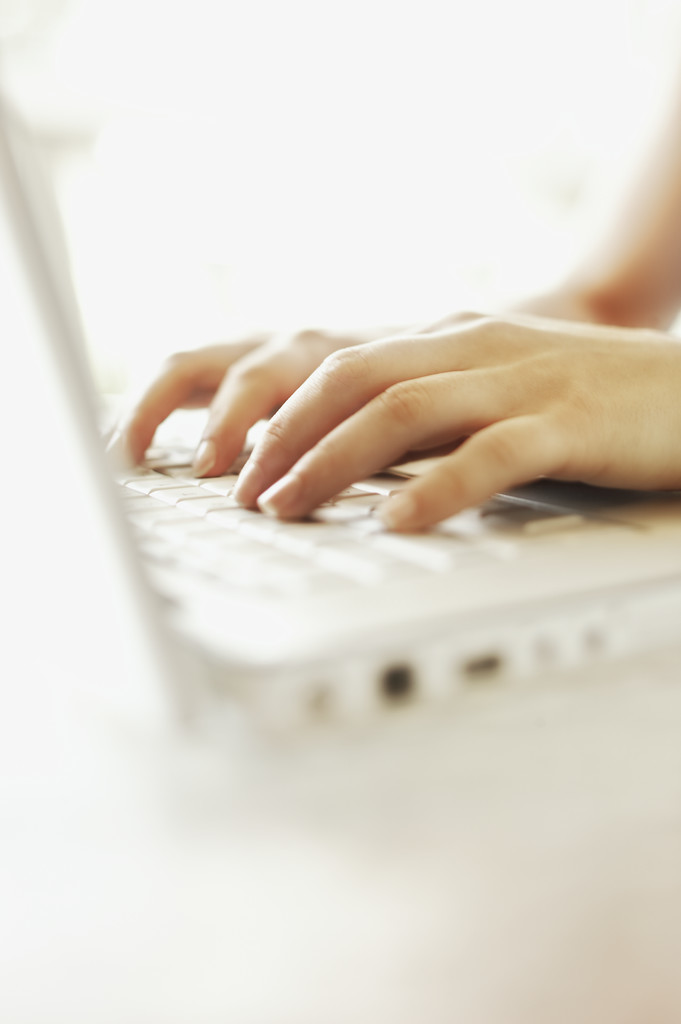 Hands of Woman Using Laptop Computer --- Image by © Royalty-Free/Corbis